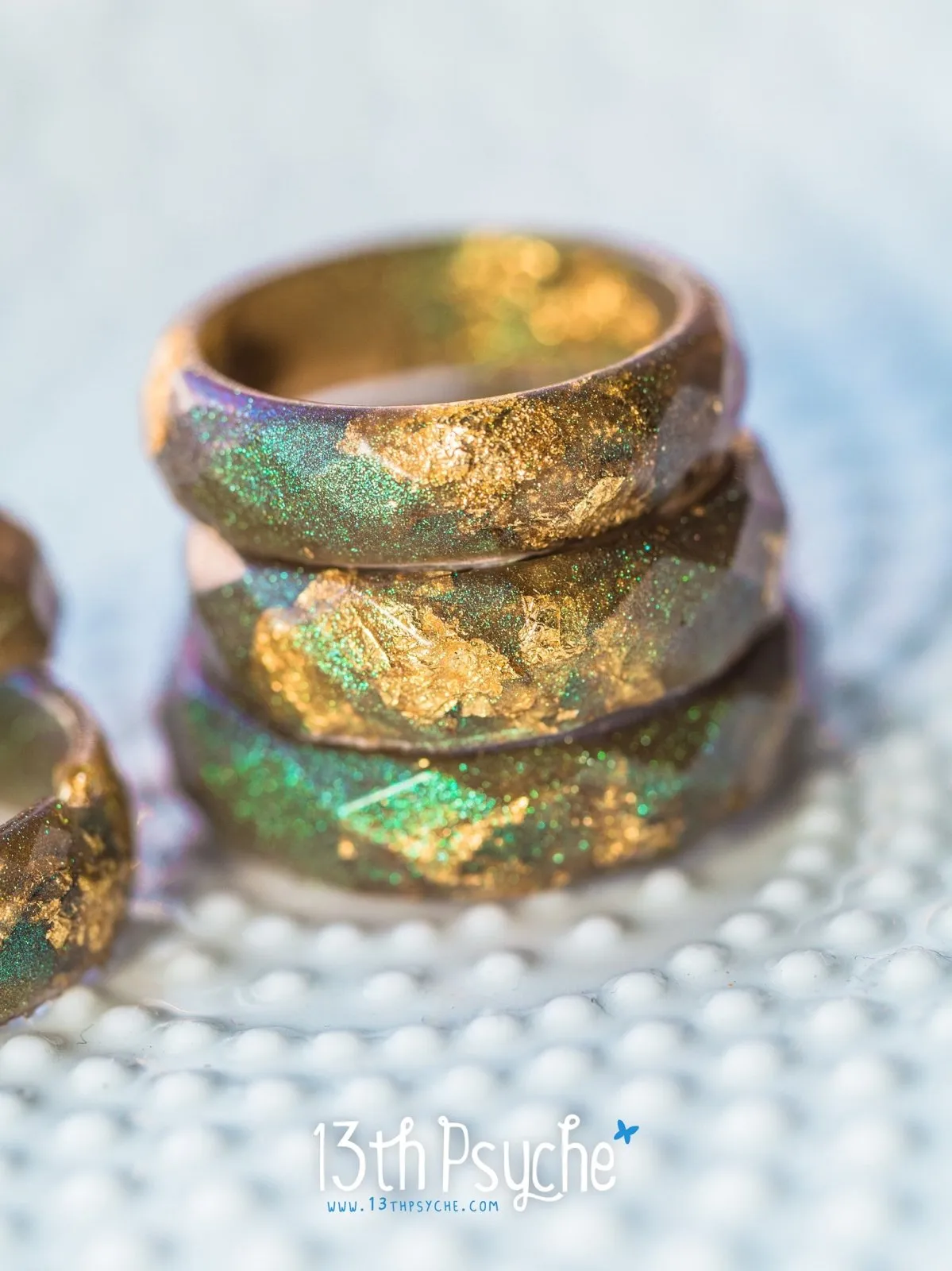 Iridescent green faceted resin ring with gold flakes