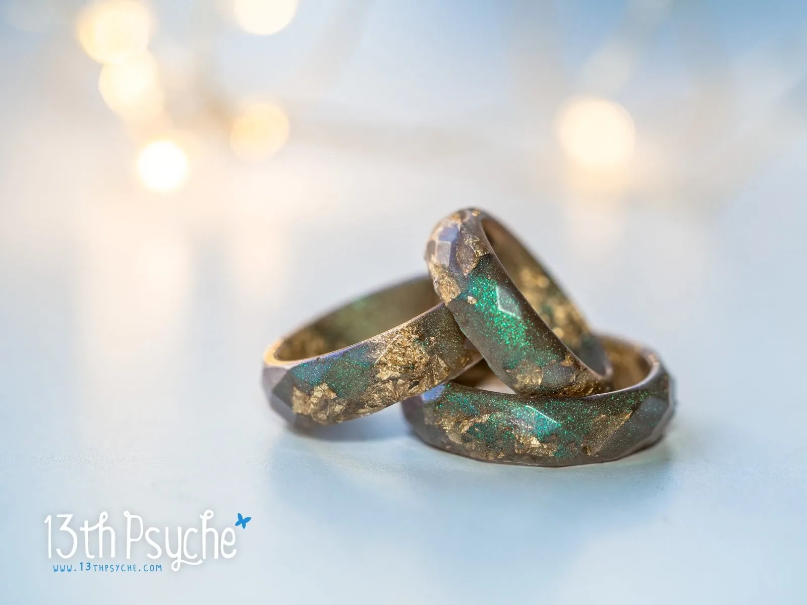 Iridescent green faceted resin ring with gold flakes